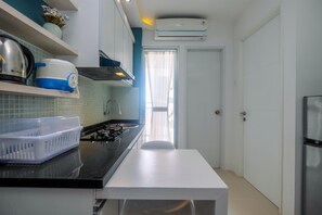 Fridge, stovetop, dishwasher, cookware/dishes/utensils - Clean and Simply Cozy 2BR Bassura City Apartment (Jakarta)
