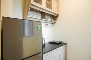 Room | Private kitchen | Fridge, stovetop, cookware/dishes/utensils - Good Location 2BR Meikarta Apartment near CBD's Area (Cikarang)