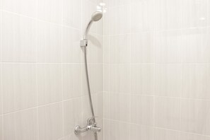 Room | Bathroom | Shower, free toiletries, towels - Zest Studio Semi Apartment at The Lodge Paskal near BINUS University (Bandung)