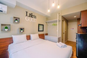 Room | Free WiFi, bed sheets - Modern and Compact Studio at Patraland Urbano Apartment (Bekasi)