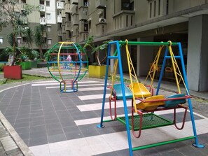 Children's play area - outdoor - Stylish & Strategic 2BR at Gateway Ahmad Yani Cicadas Apartment near Mall (Bandung)