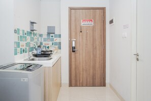 Private kitchen - Elegant and Comfort Studio at Skandinavia Apartment (Tangerang)