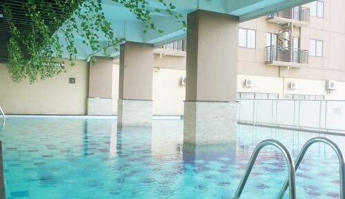 Comfy & Well Appointed 2BR at Tamansari Panoramic Apartment