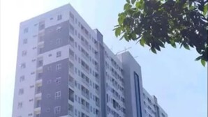 A multi-story residential building with balconies and a modern architectural design. - Fully Furnished with Cozy Design Studio Poris 88 Apartment (Tangerang)
