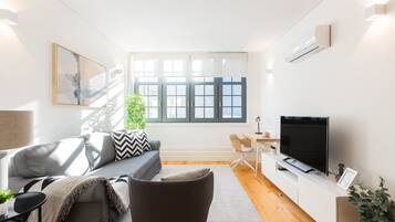 Apartment, 2 Bedrooms | Living area | 100-cm flat-screen TV with cable channels, TV