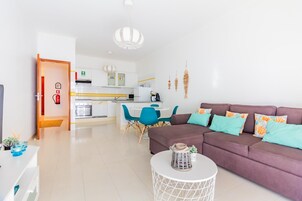 Apartment, 1 Bedroom | Living area | 50-cm TV with cable channels