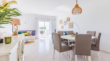 Apartment, 2 Bedrooms | Living area | 50-cm flat-screen TV with cable channels, TV