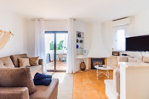 Family Apartment, 2 Bedrooms | Living area | 50-cm flat-screen TV with cable channels, TV, fireplace - Albufeira Family Oasis with Pool (Albufeira)
