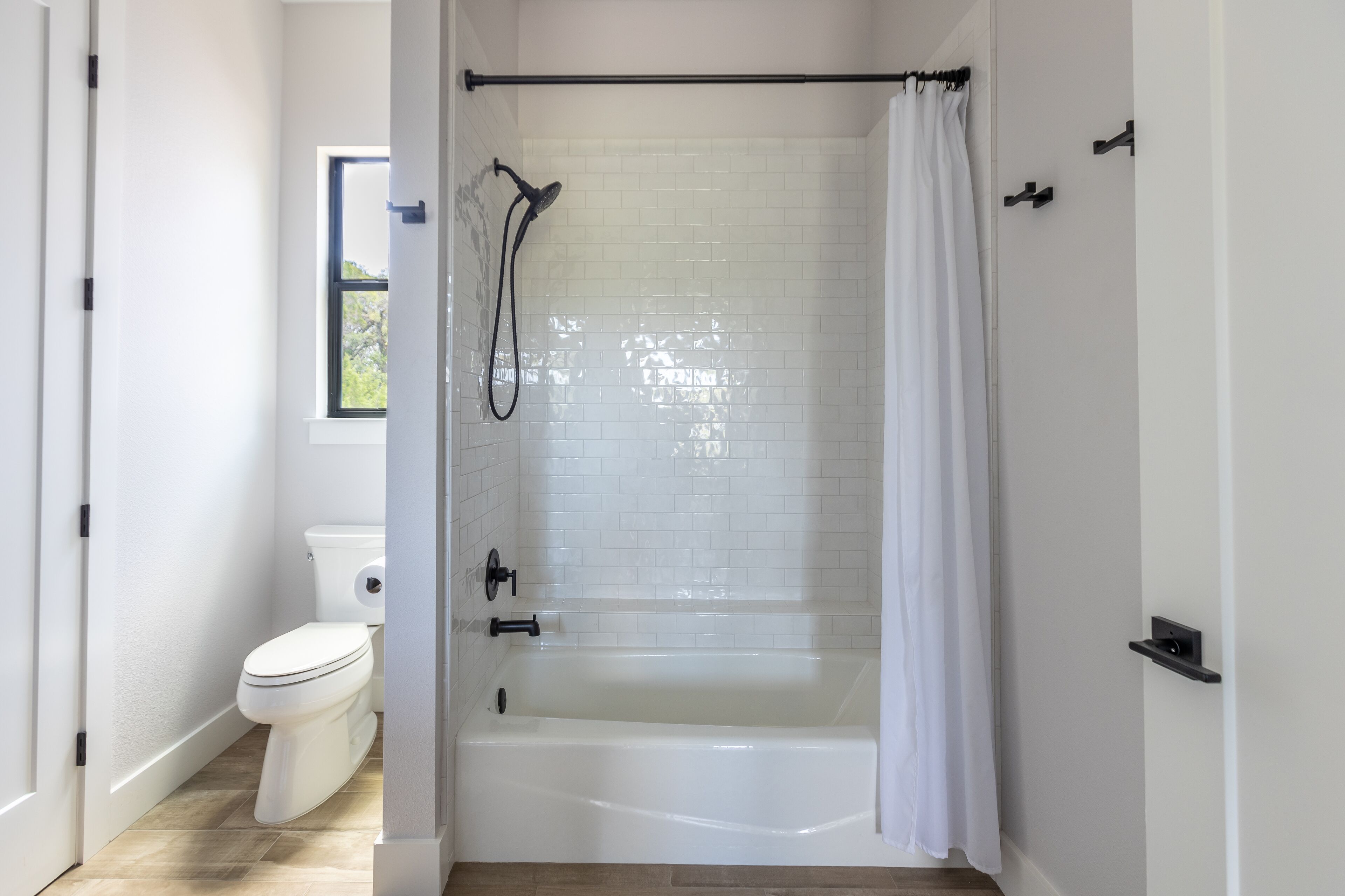 Combined shower/tub, hair dryer, towels, soap