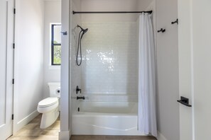Combined shower/bathtub, hair dryer, towels, soap