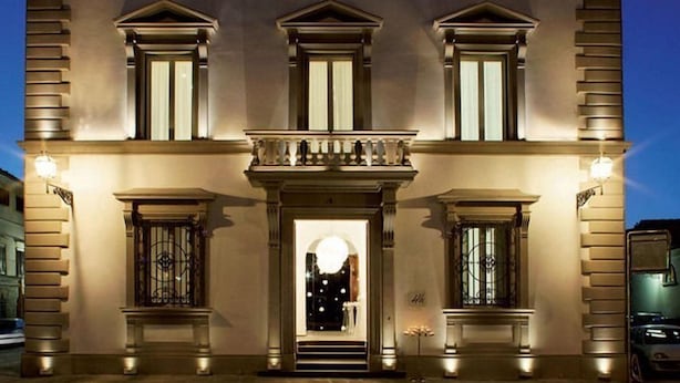 A multi-story building with a symmetrical facade, large windows, and a central entrance with steps. - Eurostars Florence Boutique (Florence)