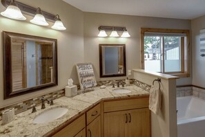 Bathtub, hair dryer, towels, soap