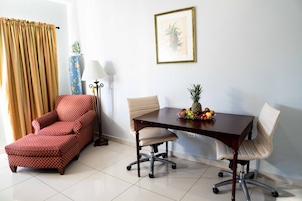 Double Room | Living area | 32-inch flat-screen TV with cable channels, TV