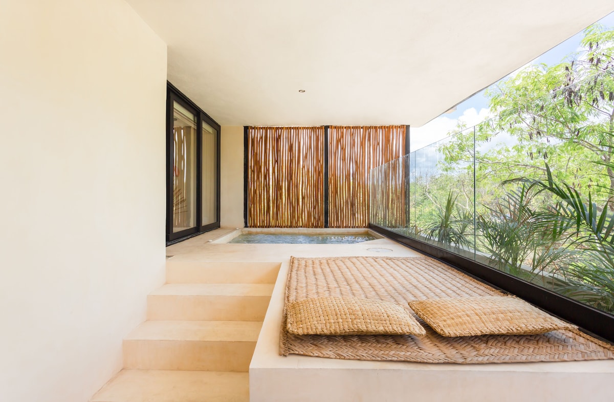 Tuluna Tulum Hotel private patio area with a lounging mat and a plunge pool