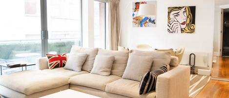 Basic Apartment, Multiple Beds | Living room | TV
