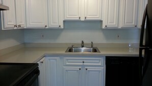 A kitchen with white cabinets, a stainless steel sink, and a dishwasher. - Summer Rental - Great Location - West End Section of Long Branch - Walk to beach (Long Branch)