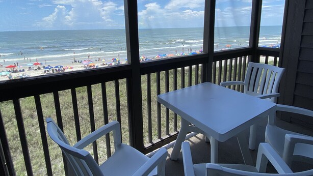 A covered outdoor seating area with a view of the beach and ocean. - Oceanfront 3 BR 2.5 bath Tilgham Beach & Racquet Club # 307. 2 pools, Tennis (North Myrtle Beach)
