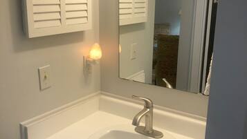 Bathtub, hair dryer, towels, soap