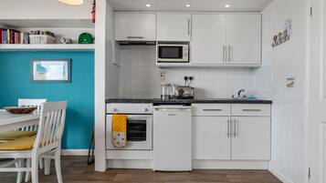 Fridge, microwave, toaster, cookware/dishes/utensils