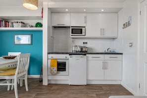 Fridge, microwave, toaster, cookware/dishes/utensils