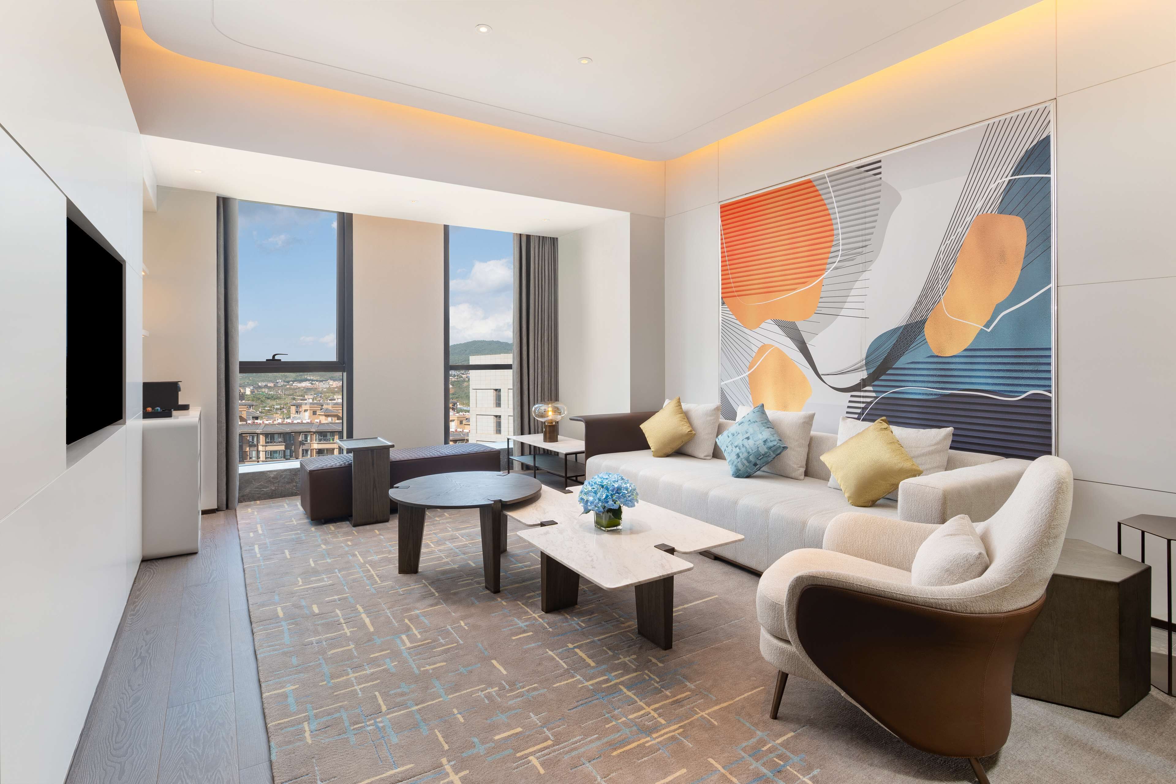 king deluxe suite | living area | 45-inch smart tv with cable channels, tv