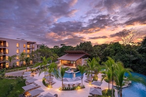 Outdoor pool, pool cabanas (surcharge), pool umbrellas - Botanika Osa Peninsula Resort, Curio Collection by Hilton (Puerto Jiménez)