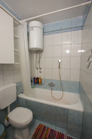 Combined shower/tub, hair dryer, towels, soap