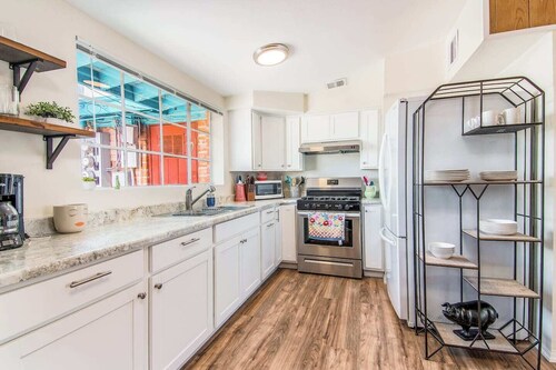 This centrally located 3 bedroom 2 bathroom features a full size pool and electric vehicle charging on site.