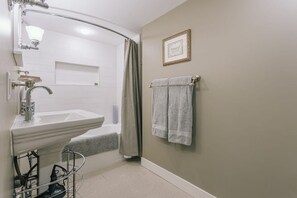 Combined shower/bathtub, hair dryer, towels, soap