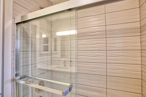 Combined shower/tub, hair dryer, towels, soap