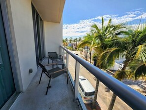 Enjoy the serene view from this balcony with a clear view of the surrounding area.