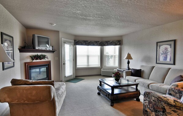 Condo, 1 Queen Bed with Sofa bed, Jetted Tub | Living area | 32-inch TV with cable channels - Unit 312 1 BD/ 1 BA Condo (Birchwood)