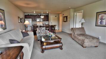 Condo, 1 Queen Bed with Sofa bed, Jetted Tub | Living area | 32-inch TV with cable channels