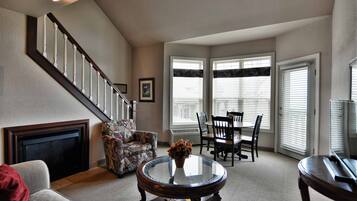 Condo, Multiple Beds, Balcony | Living room | 32-inch TV with cable channels, fireplace, MP3 dock