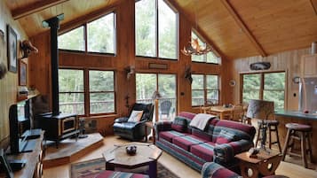 House, Multiple Beds, Patio | Living area | 32-inch TV with cable channels, fireplace