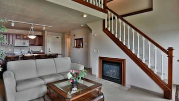 Condo, Multiple Beds, Balcony | Living room | 32-inch TV with cable channels, fireplace