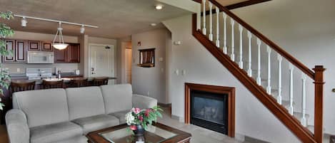 Condo, Multiple Beds, Balcony | Living room | 32-inch TV with cable channels, fireplace