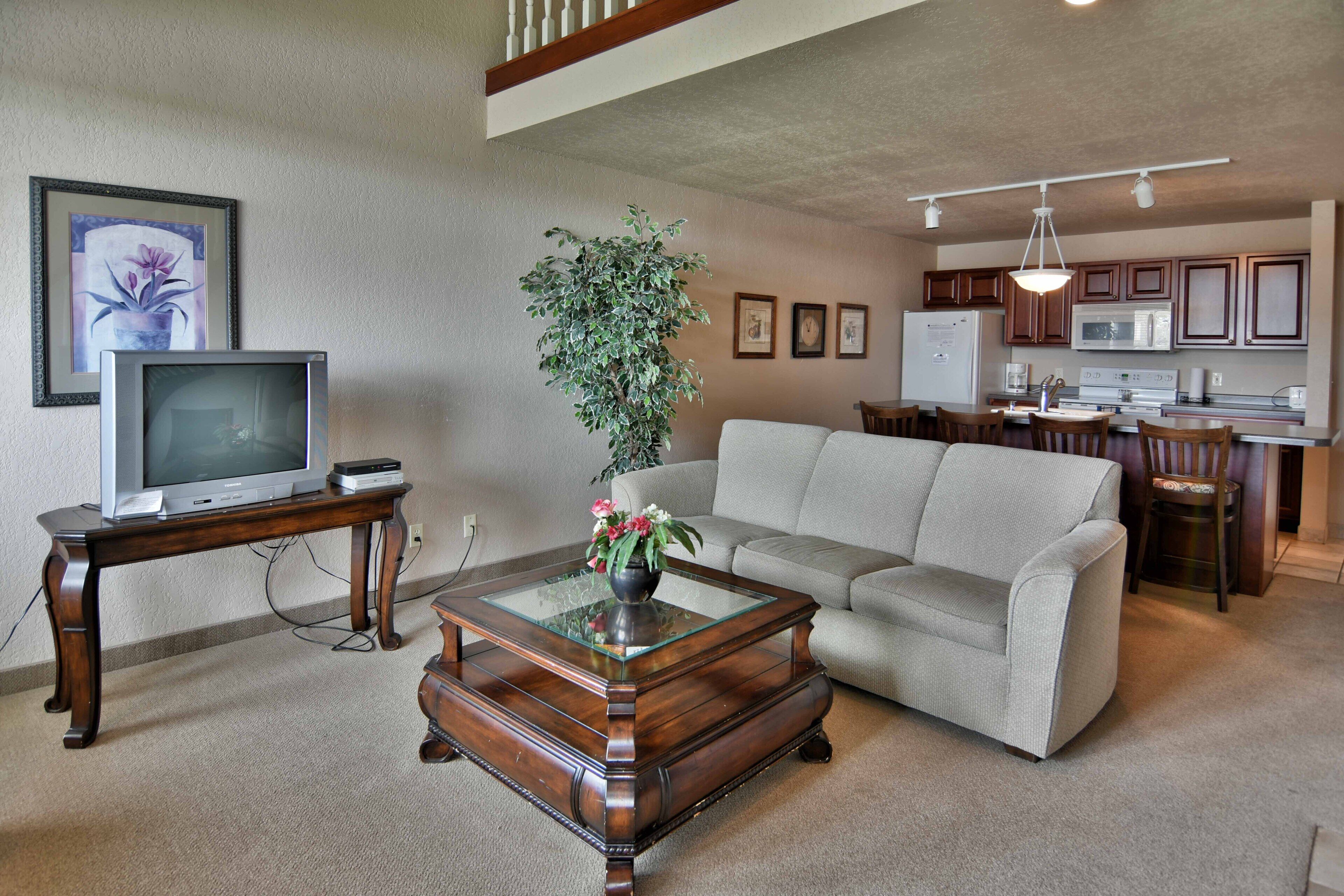 Condo, Multiple Beds, Balcony | Living room | 32-inch TV with cable channels, fireplace