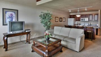 Condo, Multiple Beds, Balcony | Living room | 32-inch TV with cable channels, fireplace
