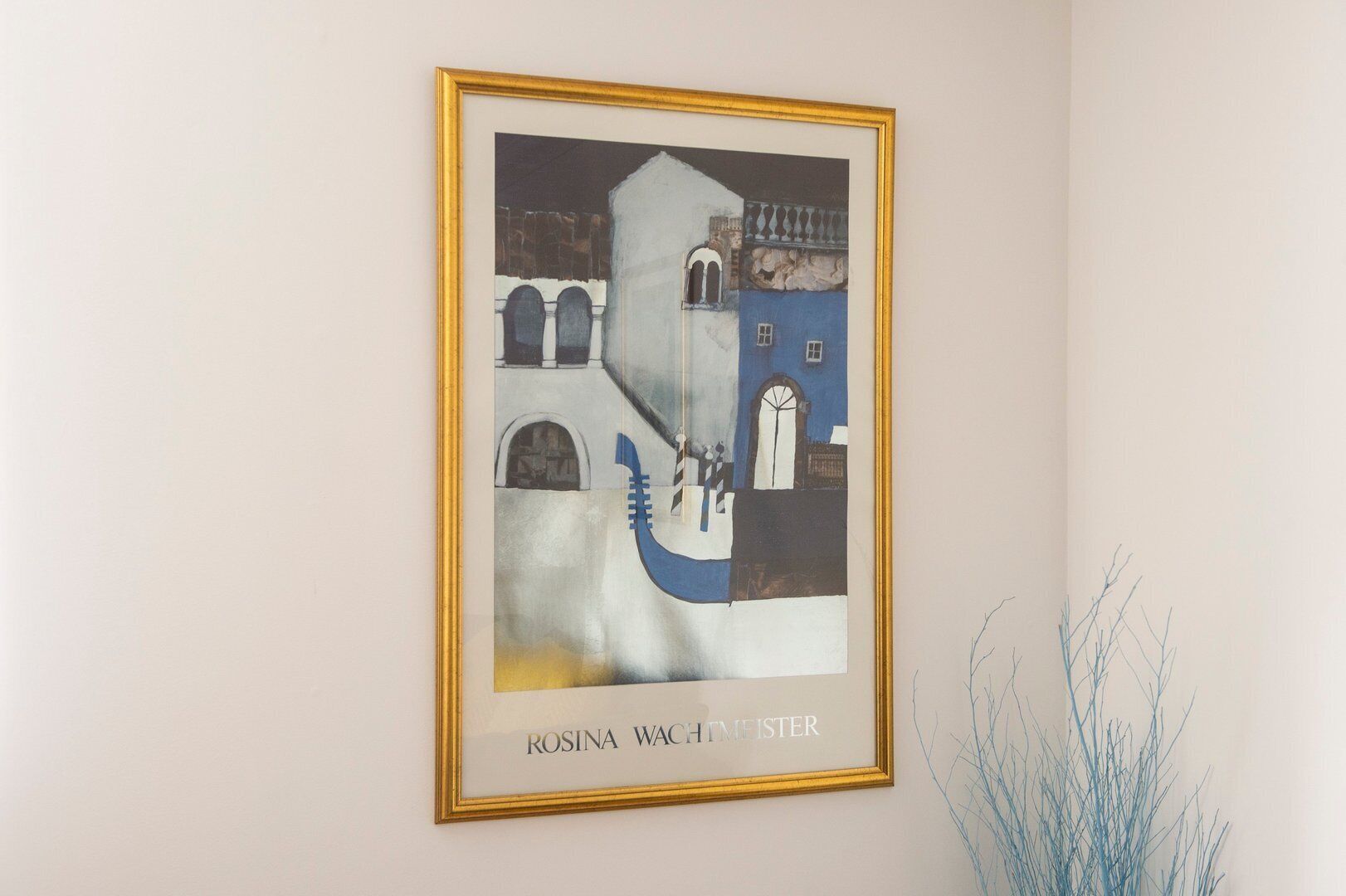 A framed artwork titled 'ROSINA WACHTMISTER' on a wall.