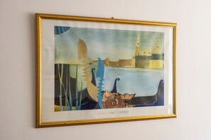 A framed artwork depicting a cityscape with a body of water, a bridge, and a tower. - GuestReady - 2BR in Leith w Ocean Views & Parking (Leith)