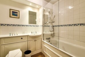 Bathtub, hair dryer, towels