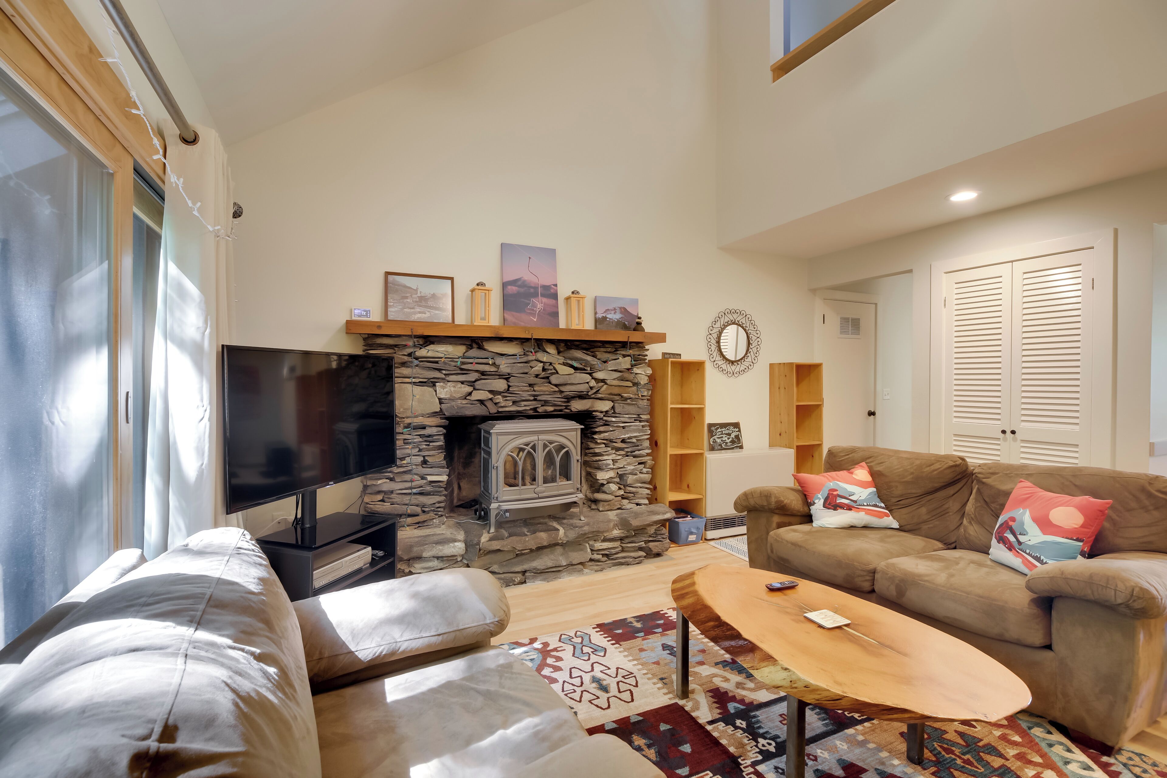 TV, fireplace, books