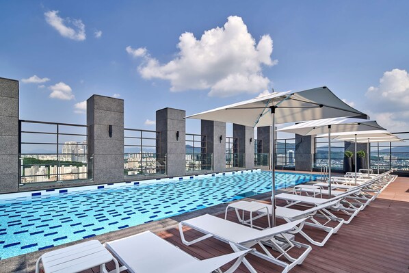 Outdoor pool, pool loungers, lifeguards on site