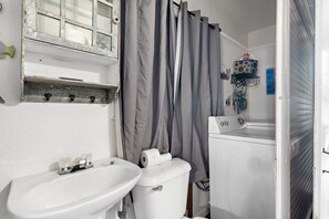 Bathtub, hair dryer, towels, soap