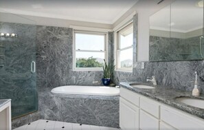 Combined shower/bathtub, hair dryer, towels, soap