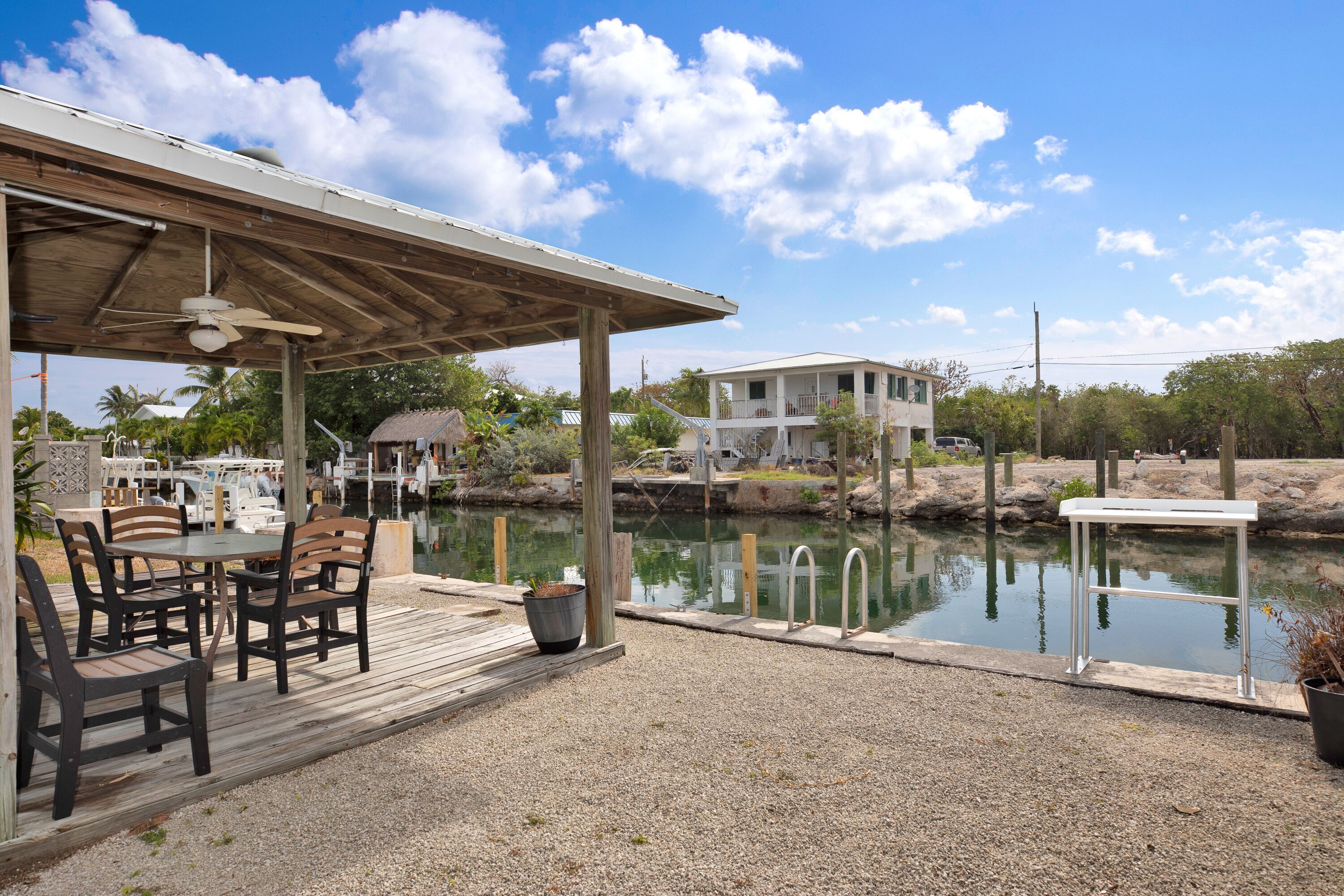 Relax, having a meal or get together under this amazing canal front tiki area.