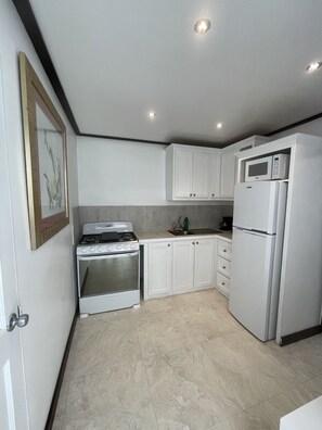 Microwave, coffee/tea maker, cookware/dishes/utensils