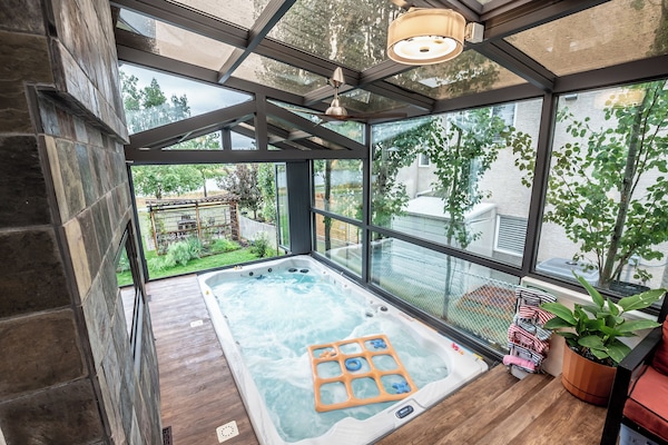 Relax in the enclosed sunroom with the spacious swim spa. the only shared space.