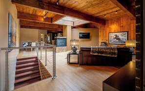 Smart TV, fireplace, books, offices